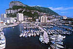 Gibraltar boat marina in background of Rock of Gibraltar